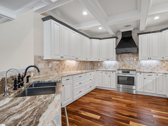 kitchen with gas stove, premium range hood, a sink, and beamed ceiling