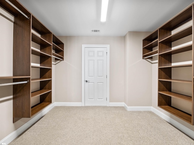 walk in closet with carpet flooring and visible vents