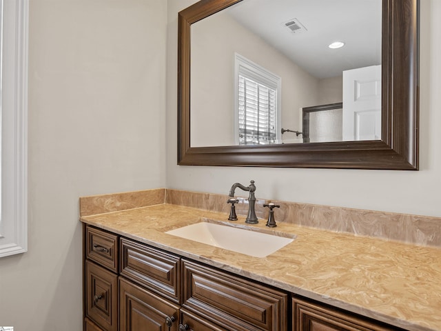 bathroom featuring visible vents and vanity