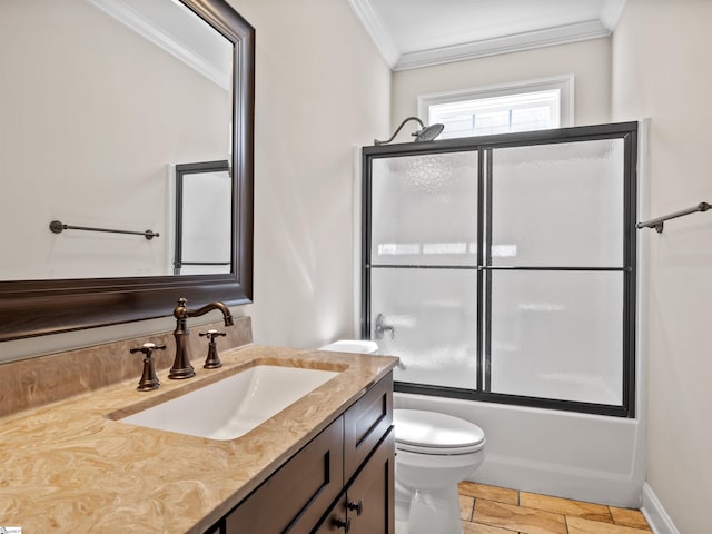 full bath featuring enclosed tub / shower combo, toilet, vanity, ornamental molding, and stone finish flooring