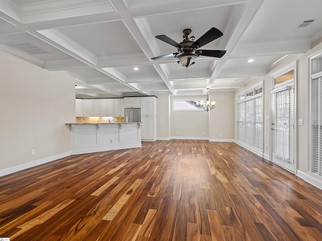 unfurnished living room with coffered ceiling, wood finished floors, visible vents, and baseboards