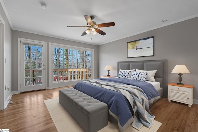 bedroom with hardwood / wood-style flooring, ceiling fan, access to exterior, and crown molding