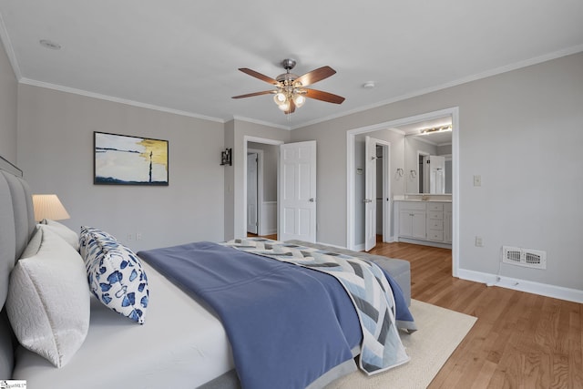 bedroom featuring ceiling fan, ornamental molding, ensuite bathroom, and light hardwood / wood-style floors