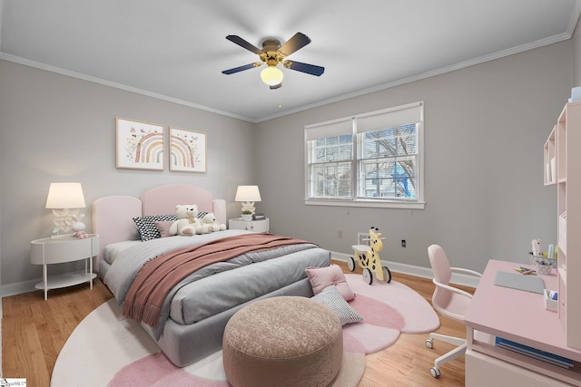 bedroom with crown molding, ceiling fan, and light hardwood / wood-style flooring