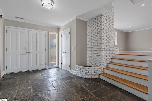 entrance foyer featuring ornamental molding