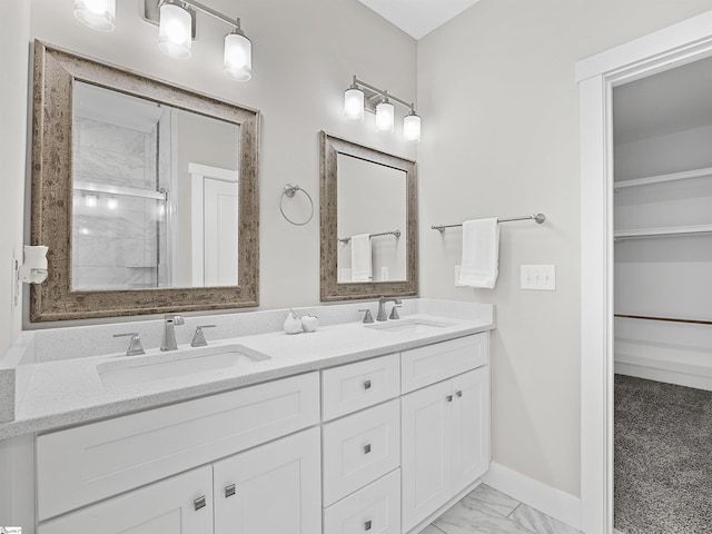 bathroom featuring vanity and an enclosed shower