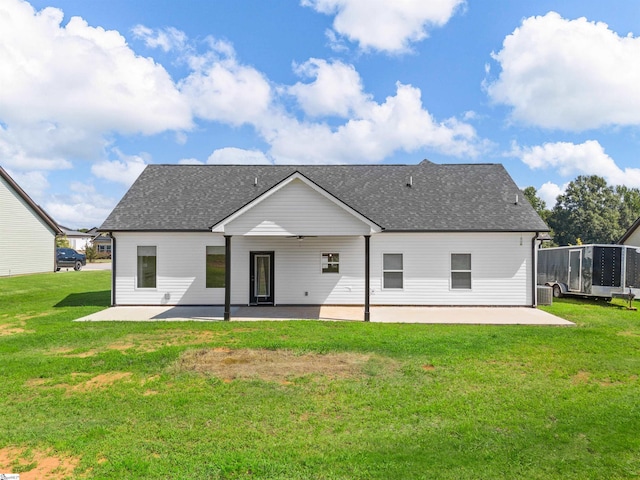 back of property featuring central AC, a patio area, and a lawn