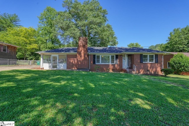 single story home featuring a front yard