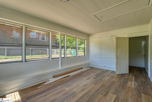 empty room with hardwood / wood-style flooring