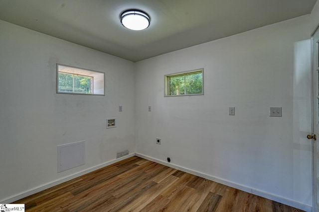 laundry room with washer hookup, hardwood / wood-style floors, and hookup for an electric dryer