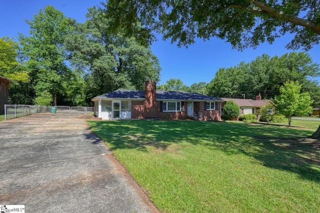 ranch-style house with a front lawn