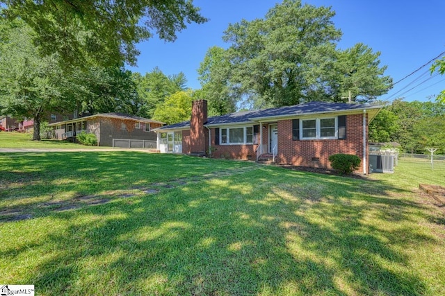 ranch-style house featuring a front yard