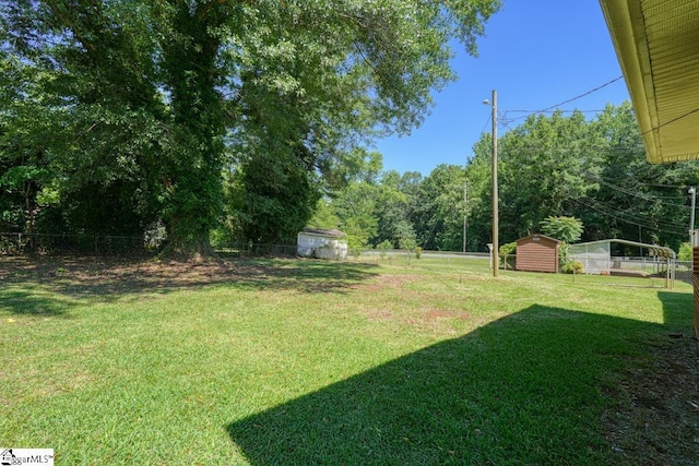 view of yard with a storage shed