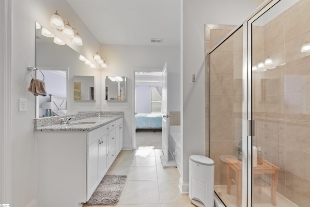 bathroom with tile patterned flooring, vanity, and an enclosed shower