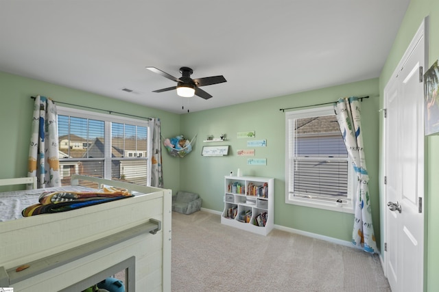 carpeted bedroom with ceiling fan