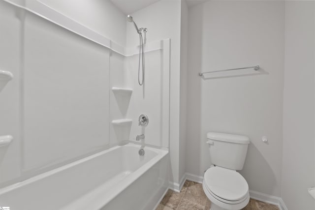 bathroom featuring bathtub / shower combination and toilet