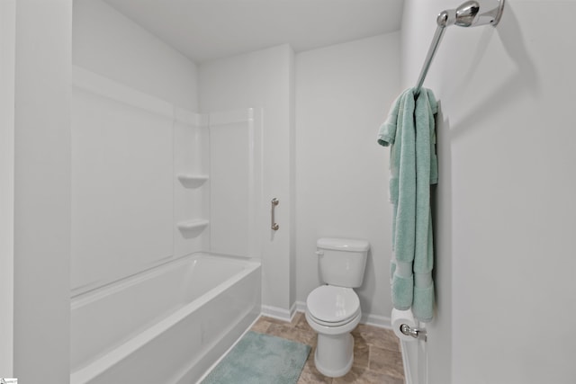 bathroom with toilet and tub / shower combination