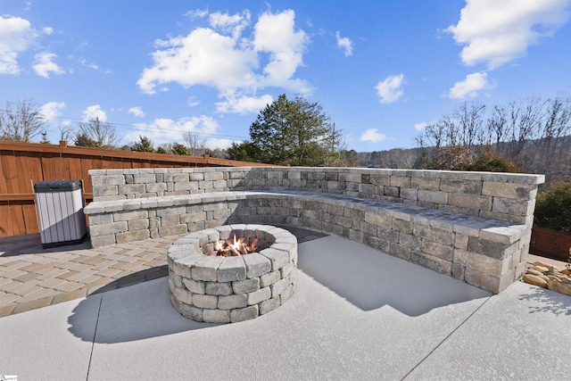 exterior details with an outdoor fire pit