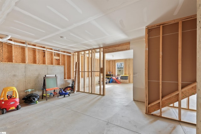 miscellaneous room with concrete flooring