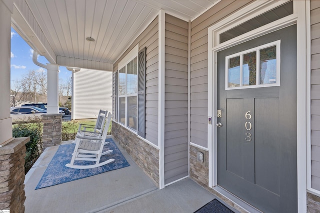 doorway to property featuring a porch