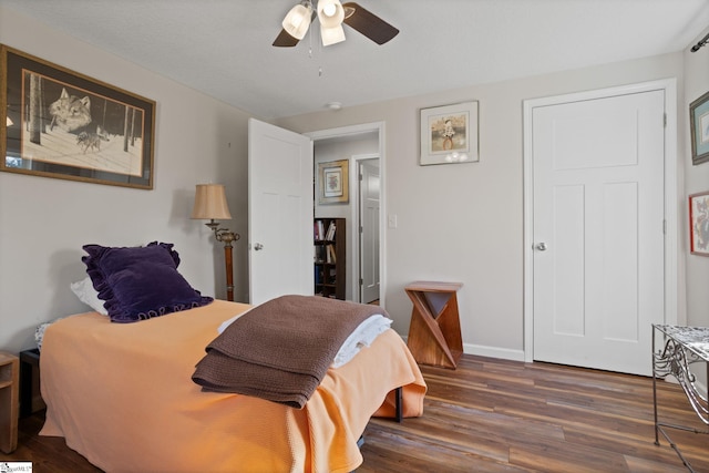 bedroom featuring ceiling fan and dark hardwood / wood-style flooring