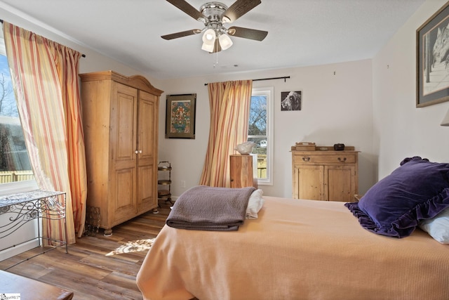 bedroom featuring hardwood / wood-style flooring and ceiling fan