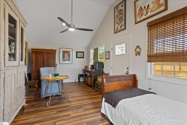 bedroom with high vaulted ceiling and dark hardwood / wood-style floors