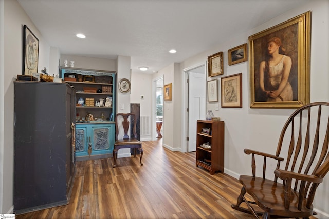 sitting room featuring dark hardwood / wood-style flooring