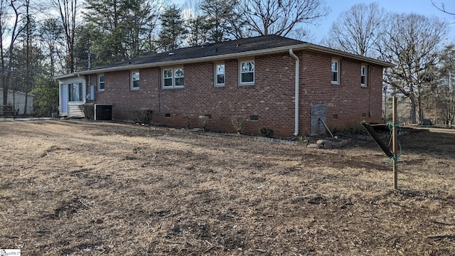 back of house featuring central AC