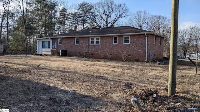 rear view of property with central air condition unit