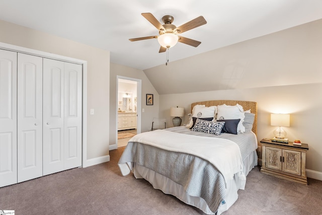 bedroom with vaulted ceiling, carpet, ceiling fan, and a closet