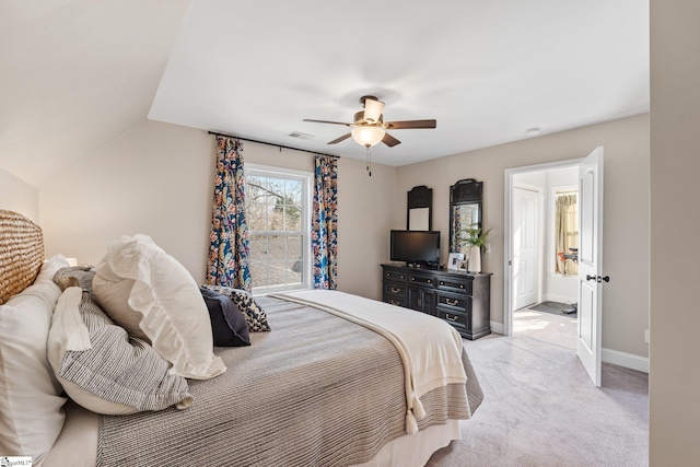 bedroom featuring light carpet, vaulted ceiling, and ceiling fan