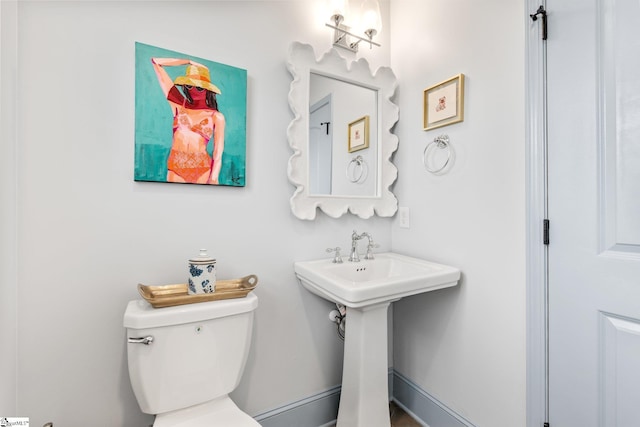 bathroom featuring sink and toilet