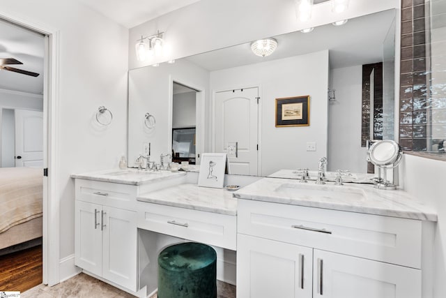 bathroom with ceiling fan and vanity