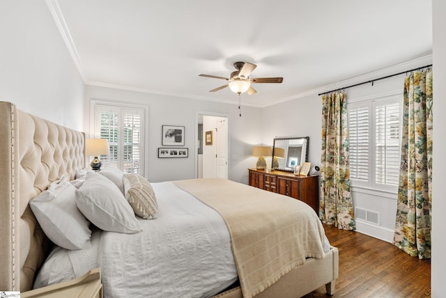 bedroom featuring ceiling fan, ornamental molding, and wood-type flooring