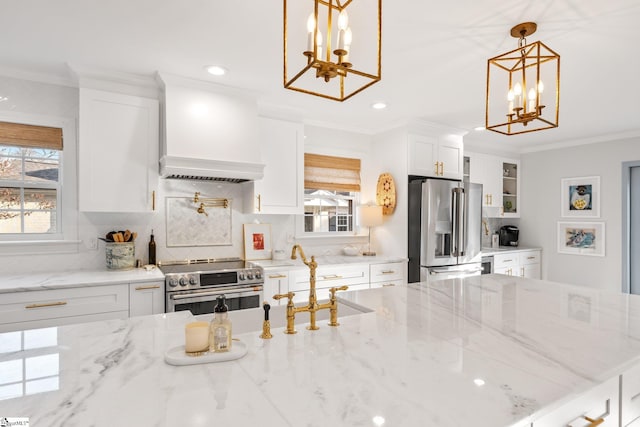 kitchen with decorative light fixtures, custom range hood, stainless steel appliances, light stone countertops, and white cabinets