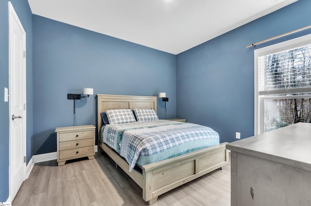 bedroom with light wood-type flooring