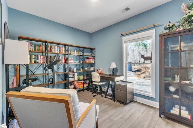 office area with light hardwood / wood-style flooring