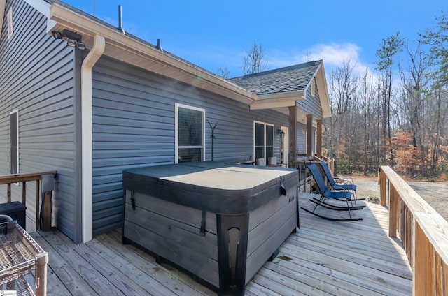 deck with a hot tub