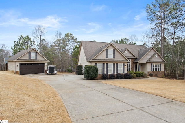 craftsman-style home featuring a garage and a front yard