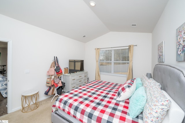 carpeted bedroom featuring lofted ceiling