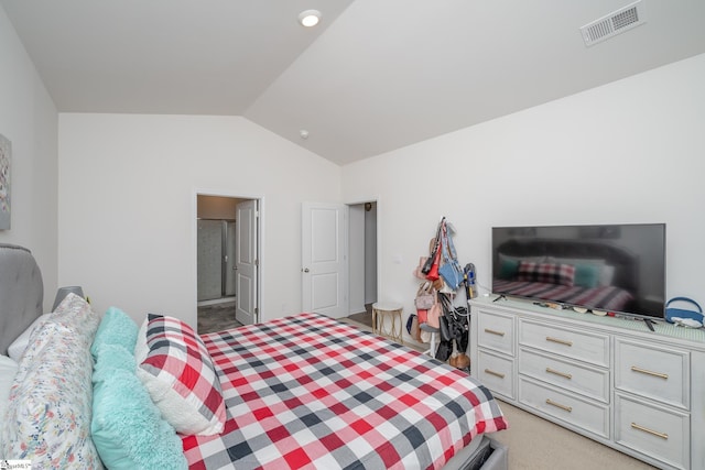 carpeted bedroom with lofted ceiling