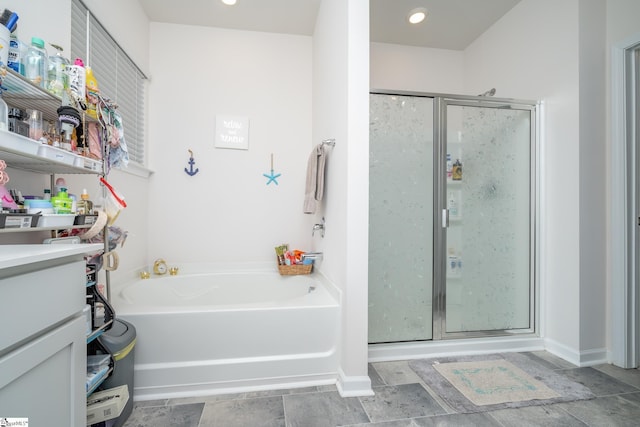 bathroom with plus walk in shower and vanity