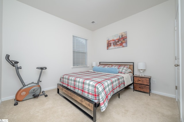 bedroom featuring light colored carpet