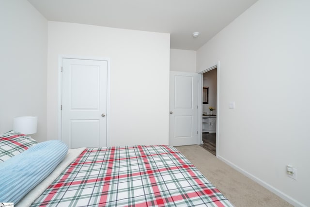 unfurnished bedroom featuring light colored carpet