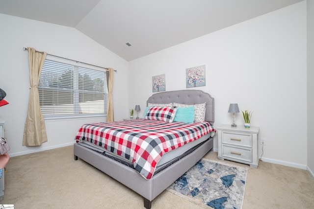 carpeted bedroom featuring vaulted ceiling