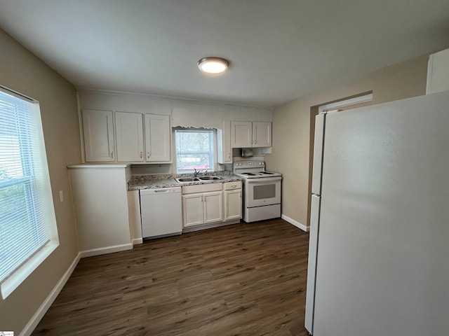 kitchen with white cabinetry, sink, dark wood-type flooring, and white appliances