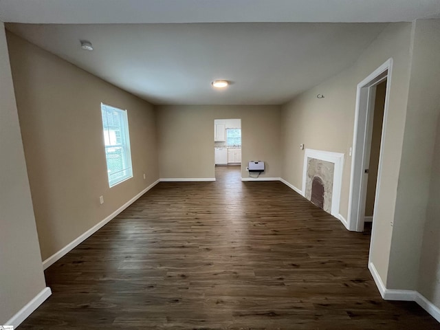 unfurnished living room featuring dark hardwood / wood-style floors