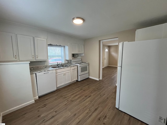 kitchen with white appliances, dark hardwood / wood-style floors, sink, and white cabinets