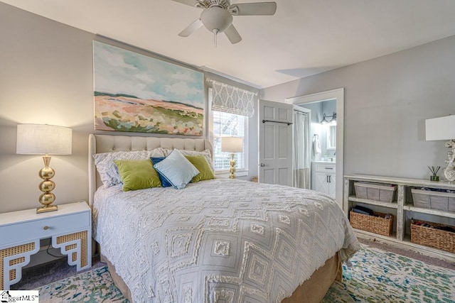 bedroom with ceiling fan and ensuite bath